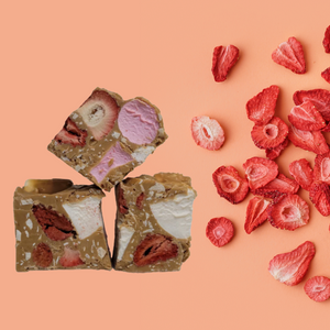 Strawberry and Almond Rocky Road in Caramel chocolate next to Freeze dried strawberries