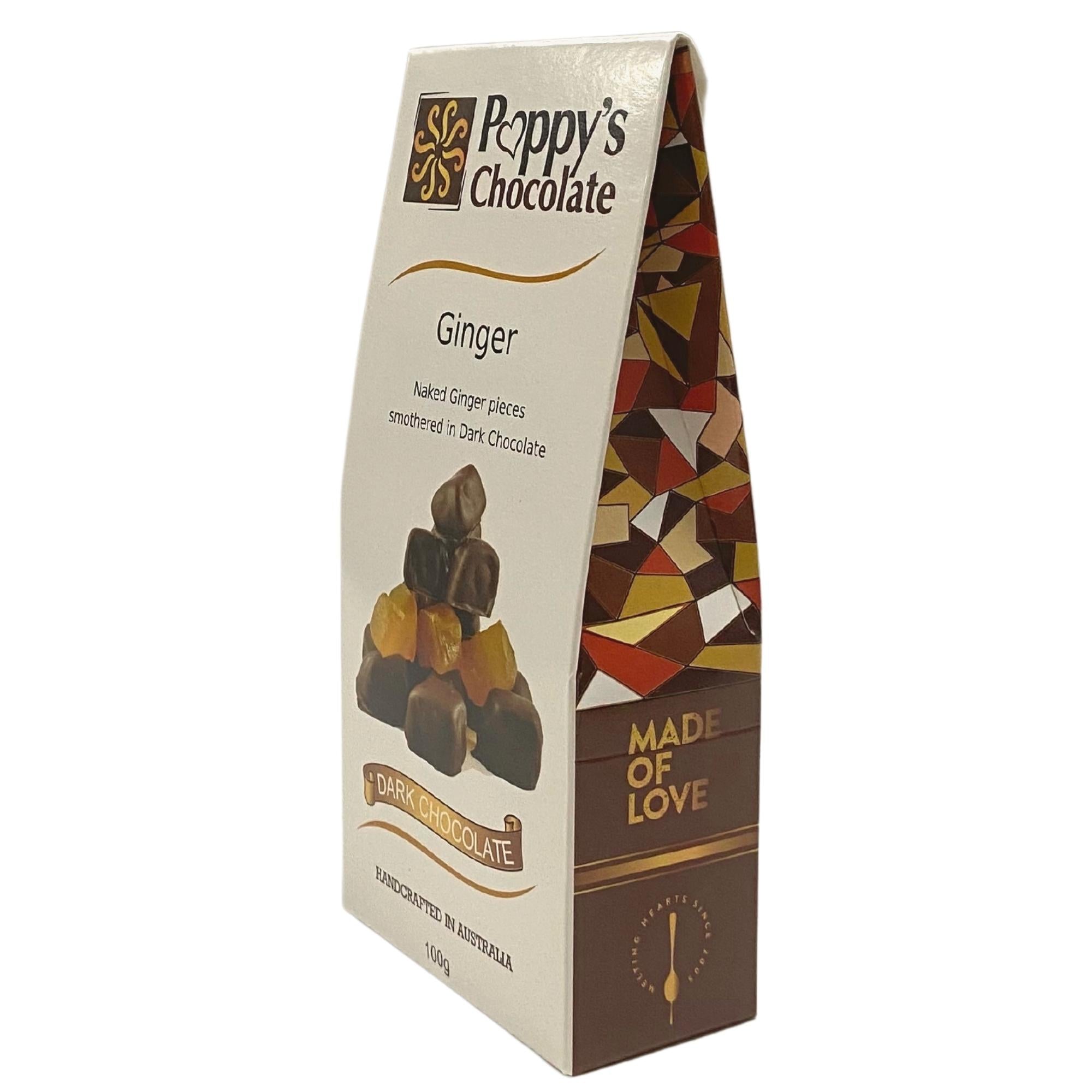 A pyramid of Poppy’s Chocolate Dark Chocolate Coated Ginger candies is arranged with vibrant, translucent yellow pieces interspersed throughout, set against a plain white background, making it an ideal gift.